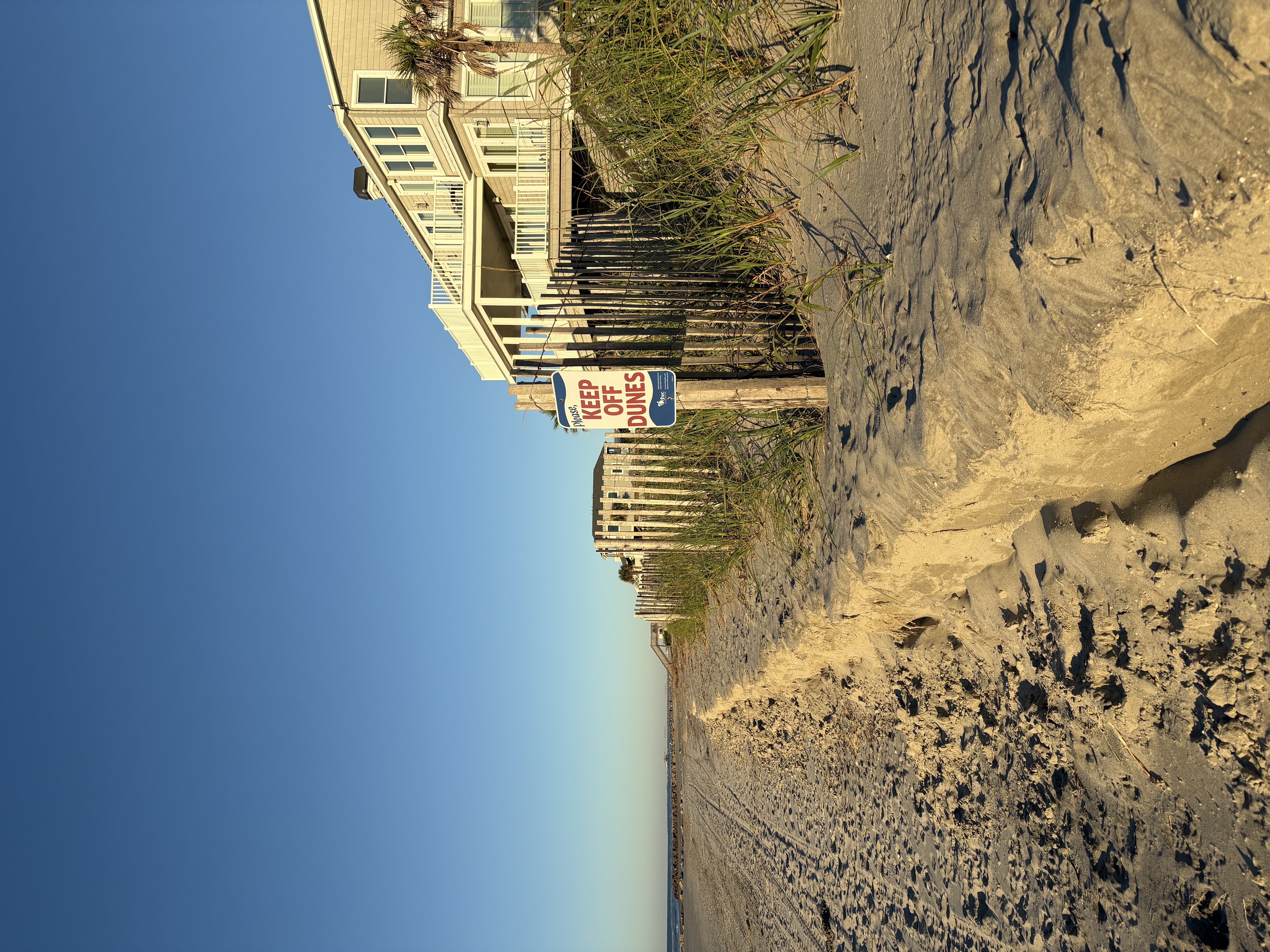 A beach with a view of the sand and the sky.